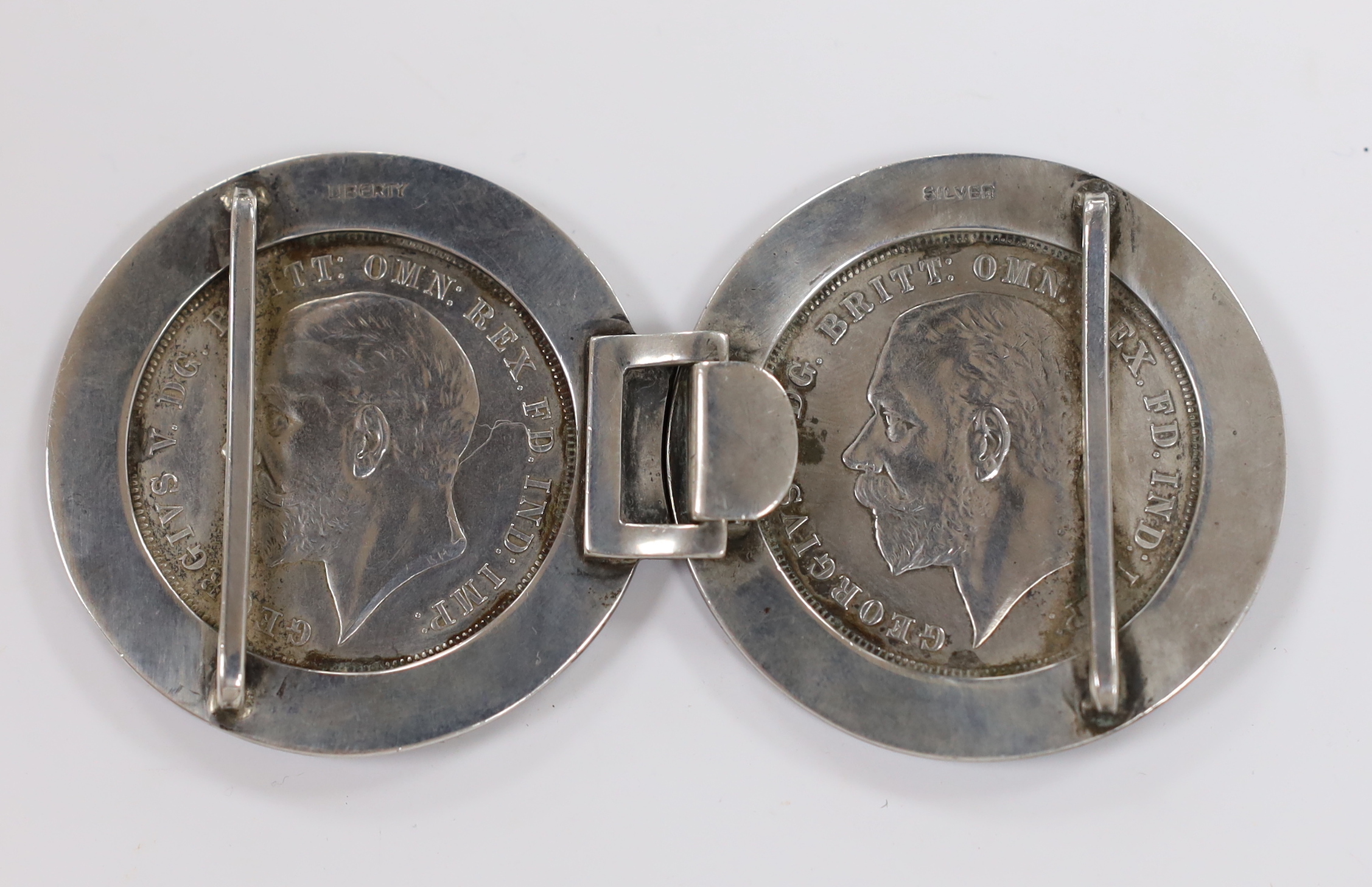 A 1930's white metal and two colour enamelled mounted twin 1933 crown coin belt buckle, stamped 'Liberty Silver', 10mm.